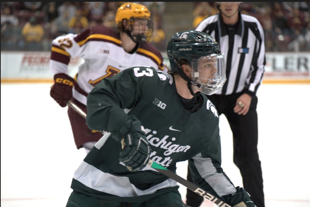 Freshman defenseman Viktor Hurtig (3) heads toward the puck at 3M Arena at Mariucci on March 11, 2023. The Spartans fell to the Gophers 5-1 in the Big Ten Tournament semifinals.