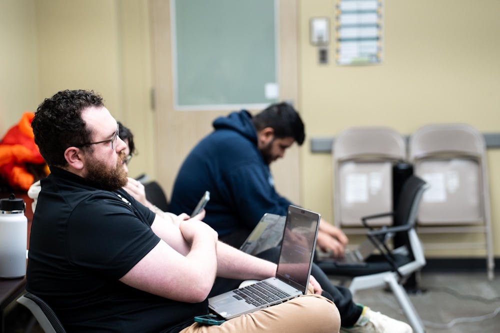 Attendees listen to the ASMSU presidential candidates at the MSU Student Services buildings on April 15, 2025
