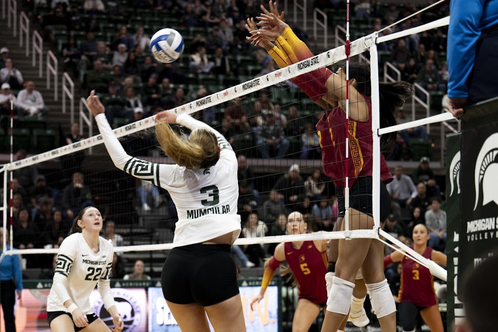 USC defenders rise to block a spike from MSU freshman outside hitter Bianca Mumcular (3) during the volleyball match at the Breslin Center on Wednesday, Nov. 26, 2025.