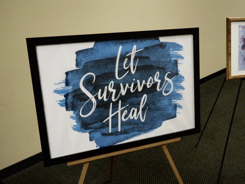 <p>A sign supporting survivors sits at the back of the room for the Teal Ribbon Ceremony at the 2019 Teal Ribbon Award and Volunteer Recognition Ceremony at the MSU Union on April 15, 2019.</p>