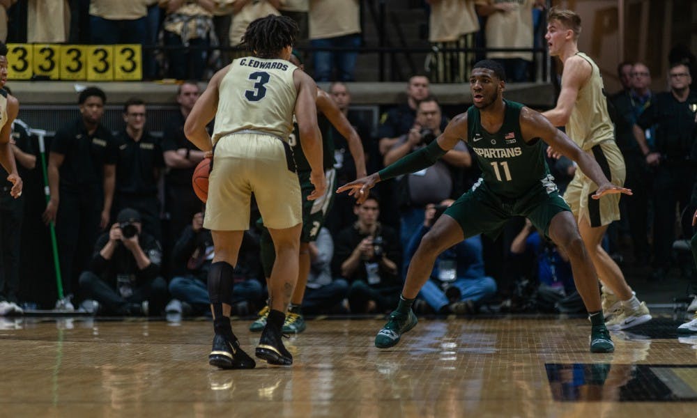 Freshman guard Aaron Henry (11) guards Purdue's Carsen Edwards at Mackey Arena on Jan. 27, 2019. The Spartans fell to the Boilermakers, 73-63.