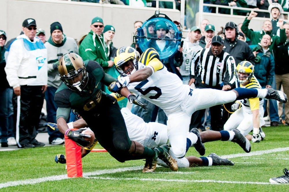Senior wide receiver Keshawn Martin reaches for his second touchdown of the day against the Wolverines. The Spartans defeated U-M, 28-14, on Saturday afternoon at Spartan Stadium. Josh Radtke/The State News