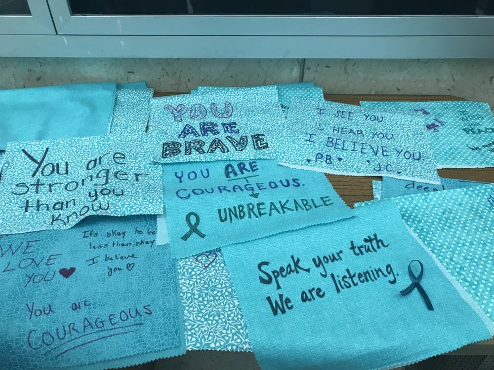 <p>Teal flags signed in support of sexual assault victims photographed on April 3, 2019. The flags were part of a project by Parents of Sister Survivors Engage and were signed by at least 4,000 MSU students with words of support for survivors of sexual assault.</p>