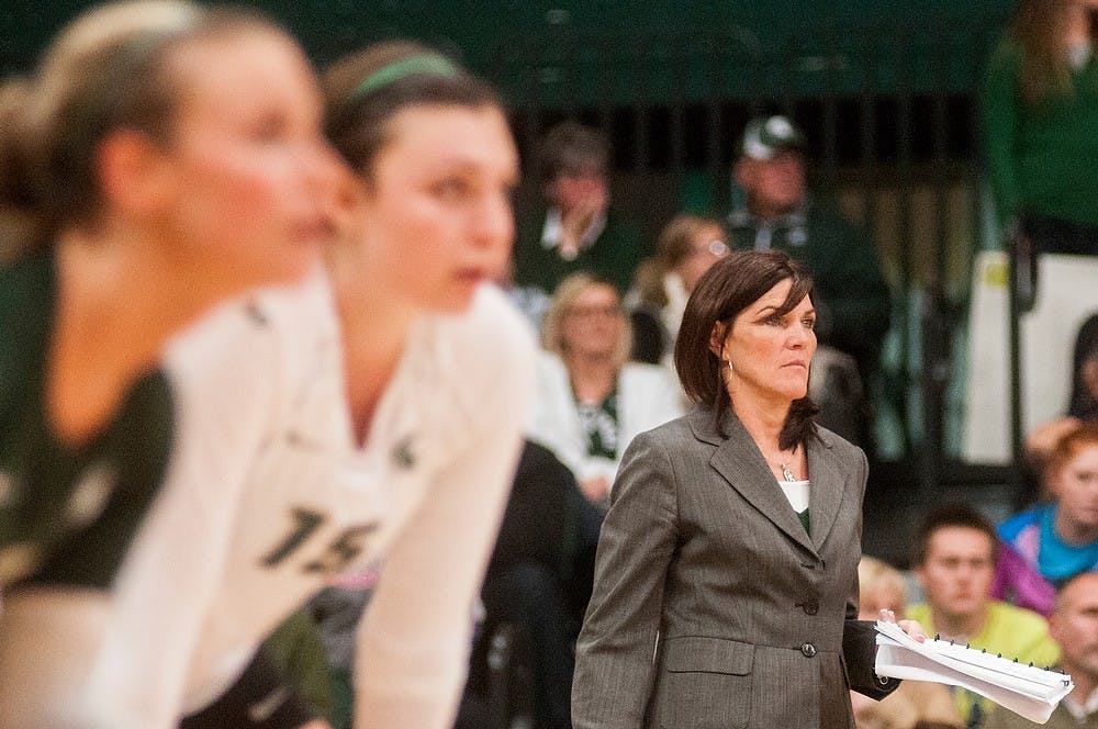 	<p>Head coach Cathy George watches the game against Michigan on Oct. 23, 2013, at Jenison Field House. The Spartans fell to the Wolverines, 3-1. Khoa Nguyen/The State News</p>