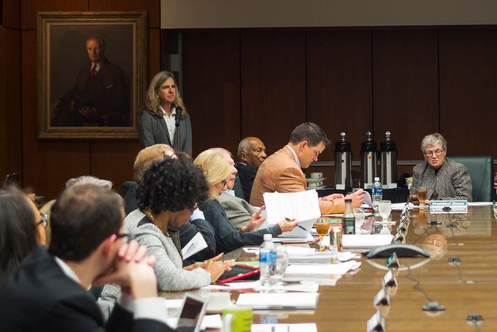 MSU professor of physics and astronomy Megan Donahue, standing on the left, presents the findings of her research program to the board of trustees during a board meeting on Feb. 17, 2017 at the Hannah Administration Building. Donahue's presentation touched on what clusters of galaxies reveal about the history and contents of the universe.