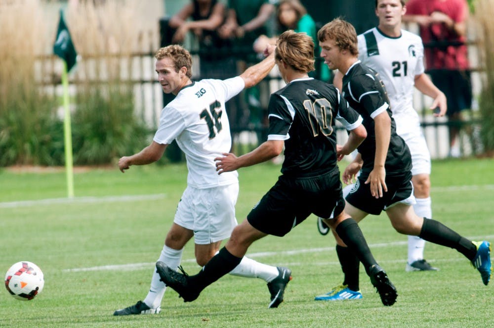 	<p>Sophomore midfielder Asa Miller dribbles the ball Sunday, Sept. 1, 2013, at DeMartin Stadium. The Spartans defeated the Western Michigan Broncos 4-0. Katie Stiefel/The State News</p>