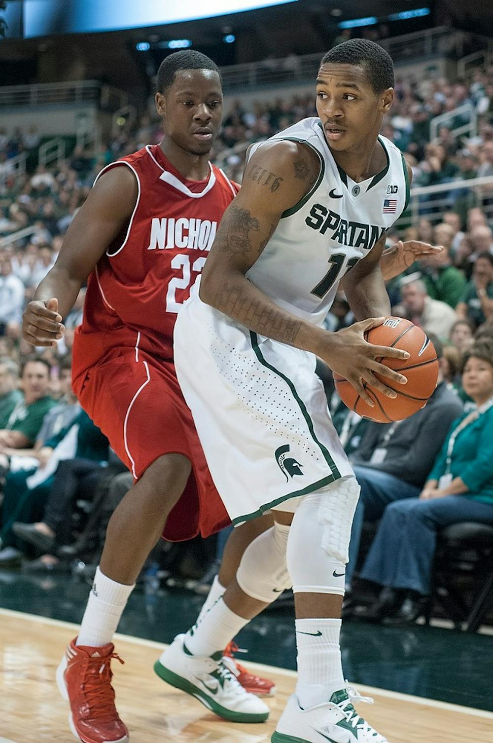 	<p>Junior guard Keith Appling looks to pass the ball during the game against Nicholls State on Dec. 1, 2012, at Breslin Center. Appling was the leading scorer for the Spartans with a total of 13 points, helping them beat the Colonels 84-39. Natalie Kolb/The State News</p>
