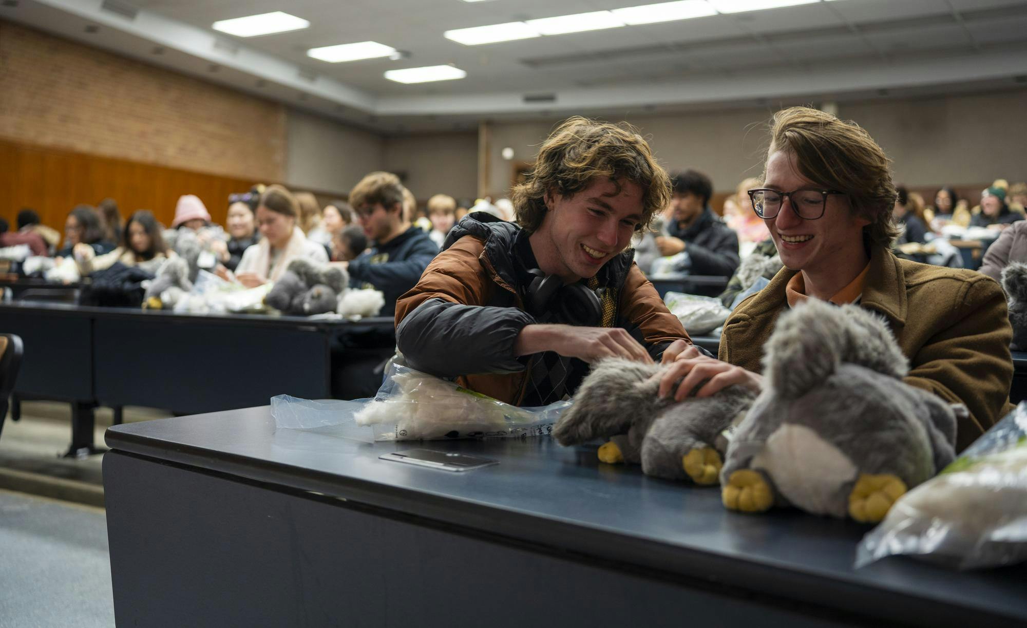 Chemical engineering freshman Aidan Cummins, left, and computer science freshman Jaxson Bryant make squirrel plushies during the University Activity Board's "Stuff-a-Stuff" event at the Engineering Building on Feb. 20, 2025.