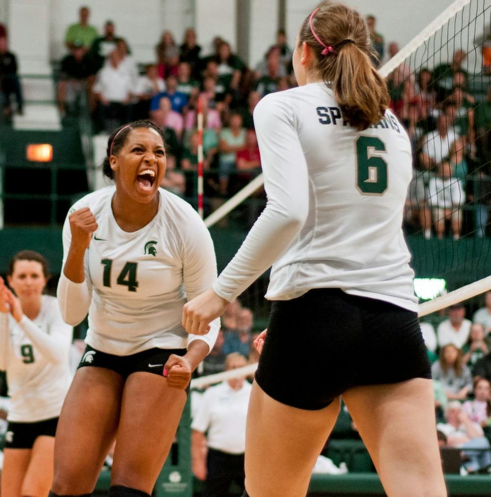 	<p>Junior middle blocker/outside hitter Jazmine White gets pumped up after getting the point Oct. 12, 2013 at Jenison Field House. The Spartans defeated the Cornhuskers, 3-1. Khoa Nguyen/The State News</p>