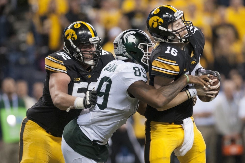 Senior defensive end Shilique Calhoun sacks Iowa quarterback C.J. Beathard for a loss of eight yards in the third quarter on Dec. 5, 2015 during the Big Ten championship game against Iowa at Lucas Oil Stadium in Indianapolis. The Spartans defeated the Hawkeyes, 16-13.