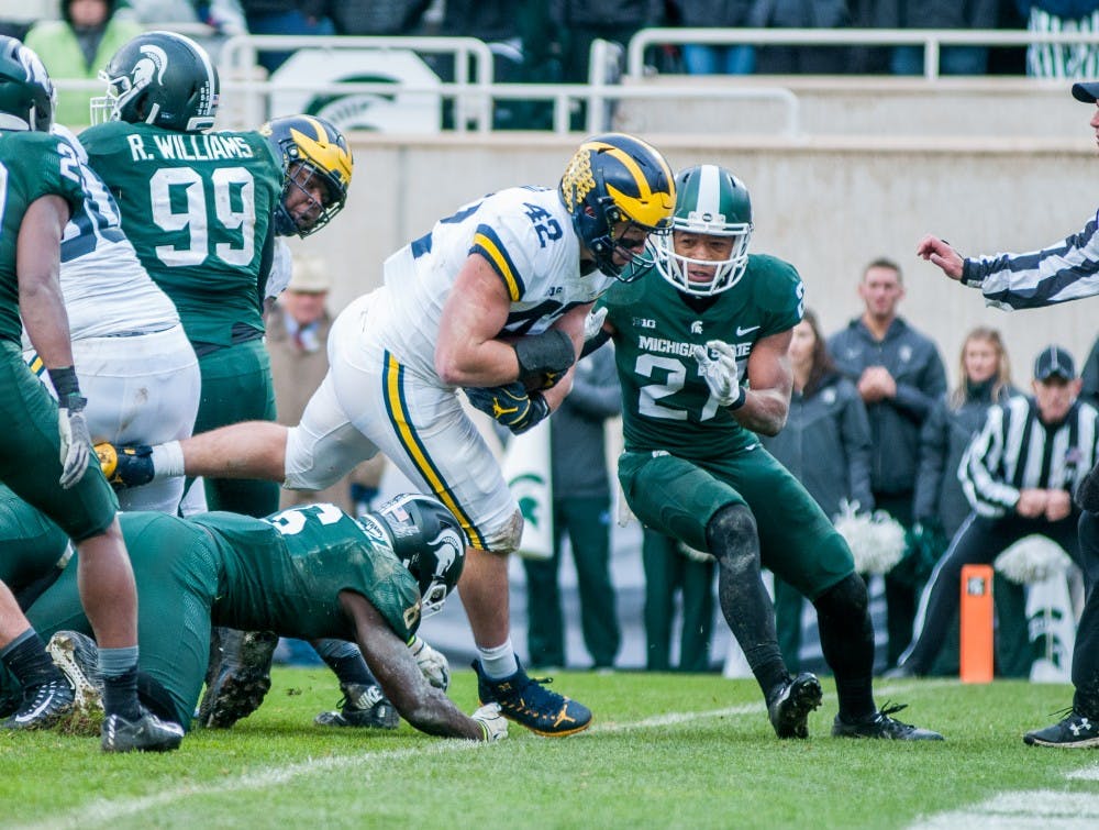 Michigan fullback Ben Mason (42) crosses the goal line for a touchdown during the game against Michigan on Oct. 20, 2018 at Spartan Stadium. The Spartans lost to the Wolverines 21-7.