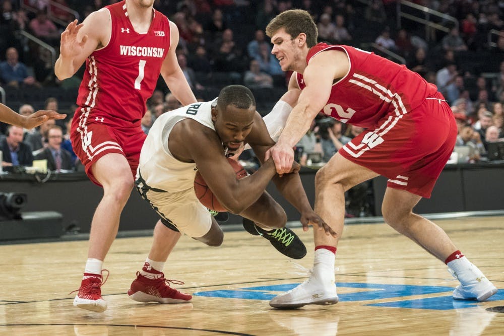 Sophomore guard Joshua Langford (1) loses his balance during the second half of the 2018 Big Ten Men's Basketball quarterfinal game against Wisconsin on March 2, 2018 at Madison Square Garden in New York. (Nic Antaya | The State News)
