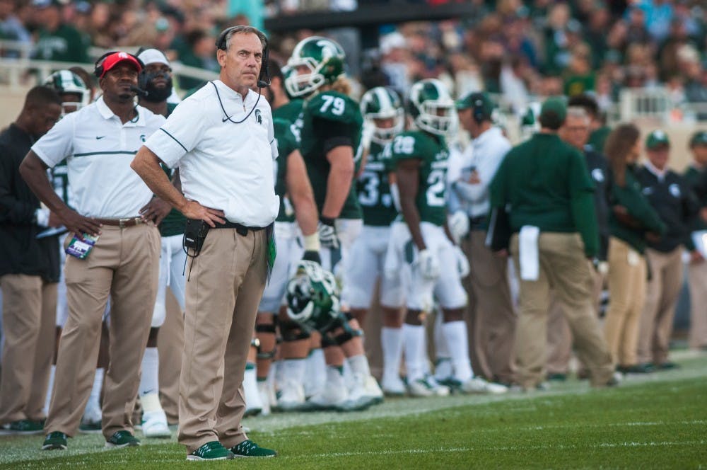 Head coach Mark Dantonio remains expressionless after Northwestern scores a touchdown during the third quarter in the game against Northwestern on Oct. 15, 2016 at Spartan Stadium. The Spartans were defeated by the Wildcats, 54-40.