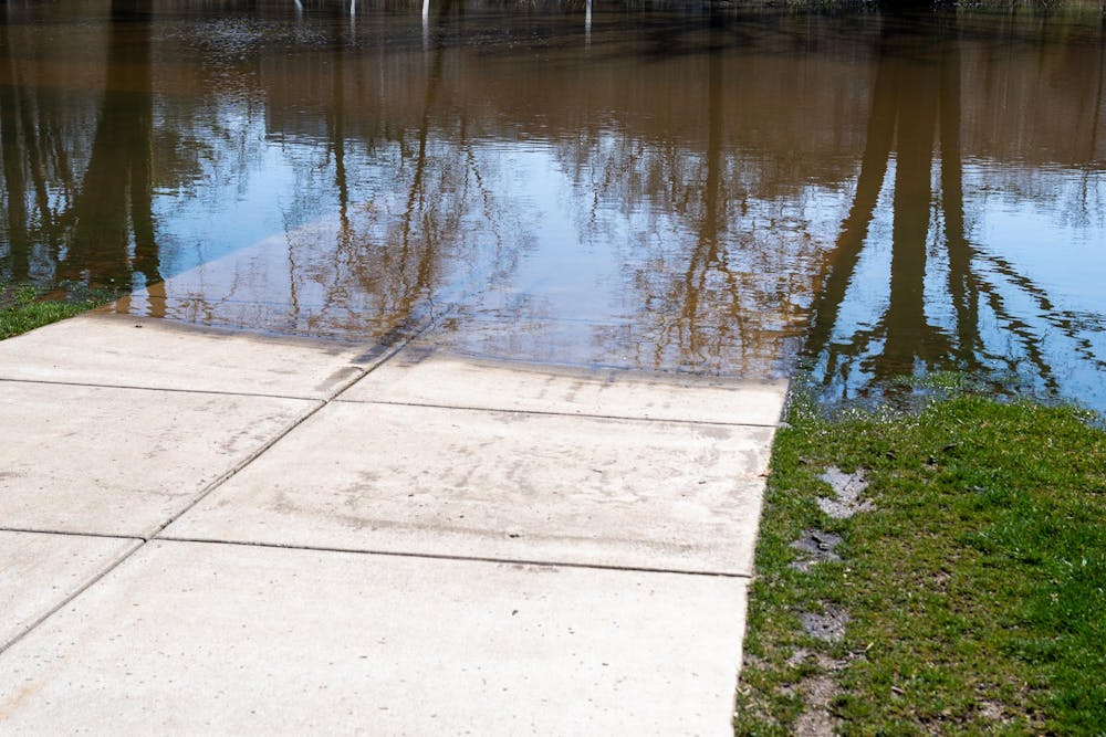 Flooding is pictured along the Red Cedar River on Michigan State University’s campus in East Lansing, Mich., on Tuesday, May 7, 2026.