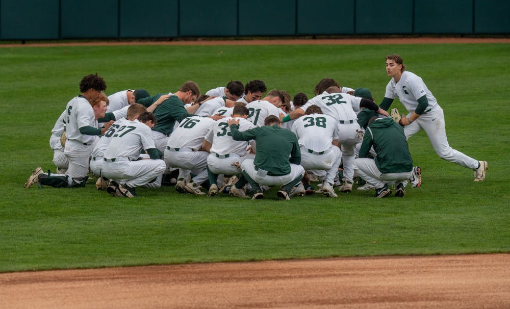 <p>The MSU Spartans huddle up before their big game against Western Michigan on April 13, 2022. MSU would end up losing the game 18-7.</p>