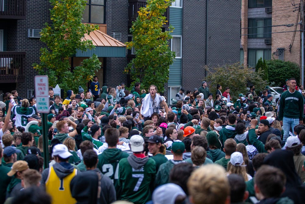 <p>MSU fans gather in Cedar Village after MSU&#x27;s victory over the University of Michigan on Oct. 30, 2021. </p>