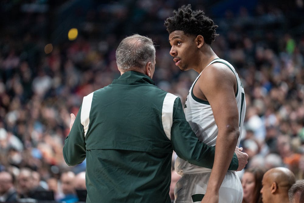 <p>Head men's basketball coach Tom Izzo talks with junior guard AJ Hoggard at Nationwide Arena in Columbus, Ohio on March 17, 2023. The Spartans beat the Trojans, 72-62 in the first round of March Madness.</p>