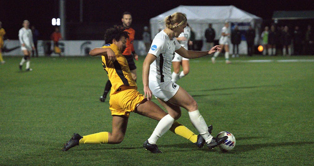<p>Spartan player fights for the ball during the playoff game against the Panthers on Nov. 11, 2022. ﻿The Spartans won in double overtime, 3-2. </p>