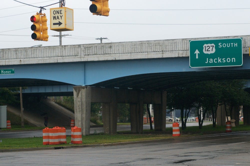 <p>The bridge located above Michigan Ave. between Howard Street and Homer Ave. on Aug. 29, 2015. Courtney Kendler/The State News</p>