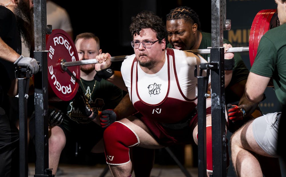 <p>Matheo Perez squats with 242.5 kg at the 2025 USA Powerlifting Michigan State Championships in Lansing, Mich., on Nov. 23, 2025.</p>