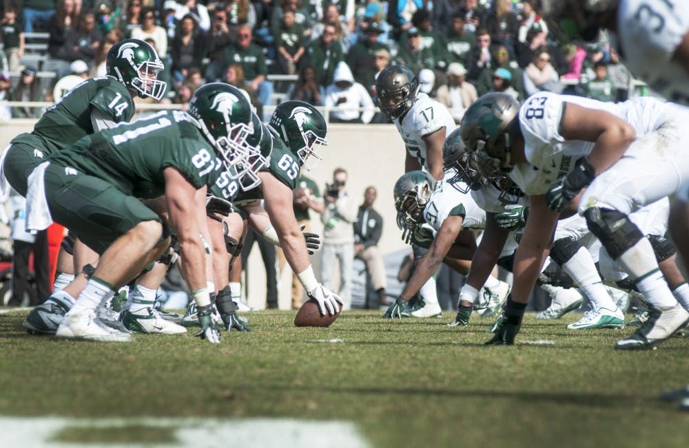 Senior offensive lineman Brian Allen (65) lines up for the snap during the Green and White Spring Game on April 1, 2017 at Spartan Stadium. The White team defeated the Green team, 33-23.