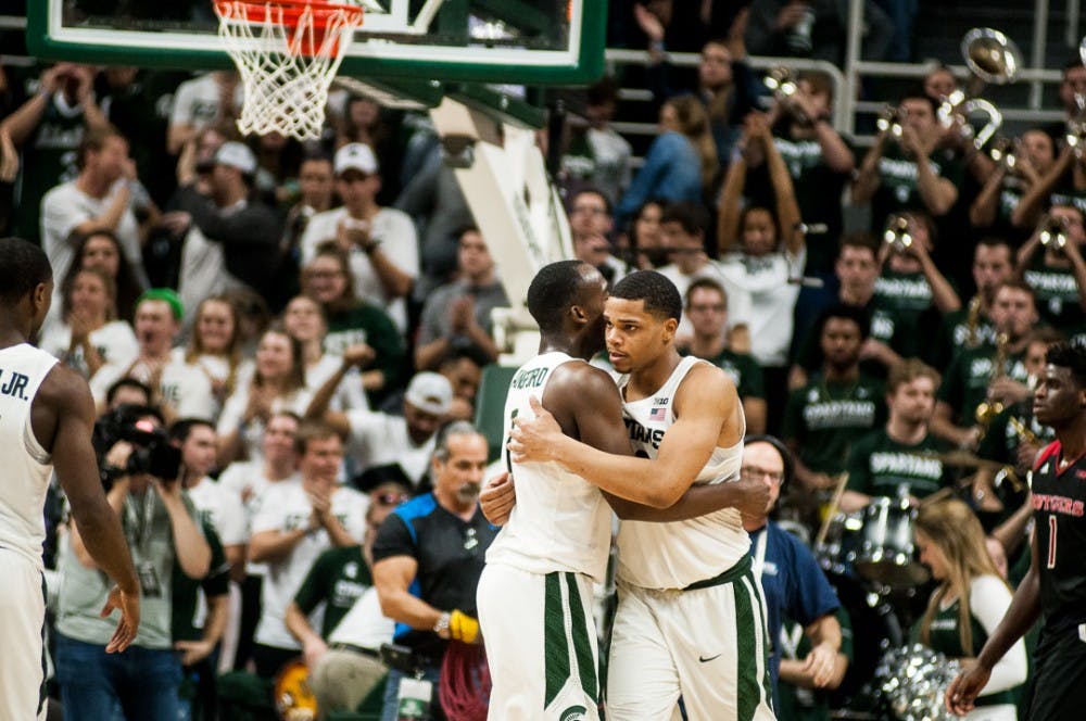 Sophomore guard Miles Bridges (22) hugs sophomore guard Joshua Langford (1) after the game against Rutgers on Jan. 10, 2018 at Breslin Center.  The Spartans beat the Scarlet Knights 76-72.