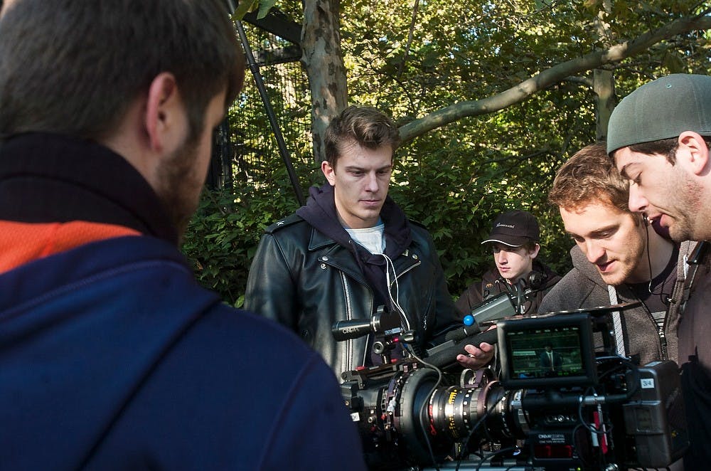 <p>MSU basketball senior guard Keenan Wetzel discusses a scene with the crew Sept. 19, 2014, while filming the movie "The Cager" at Potter Park Zoo in Lansing. Erin Hampton/The State News</p>