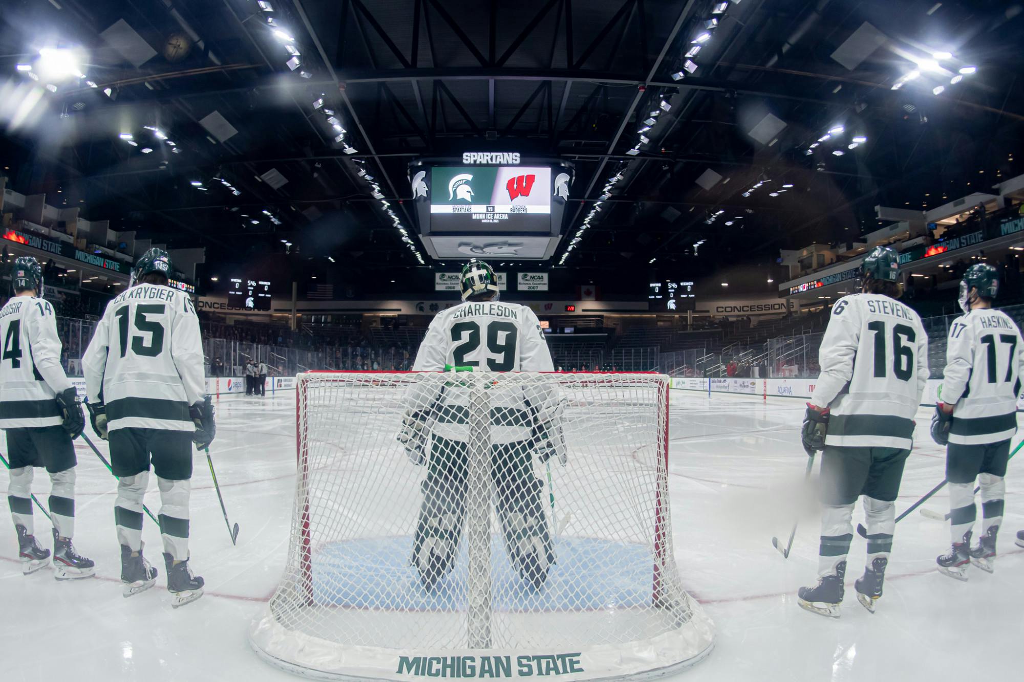 <p>Then-freshman goalie Pierce Charleston and the Spartans line up on the ice for the National Anthem on Mar. 6, 2021. The Spartans fell 2-1.</p>