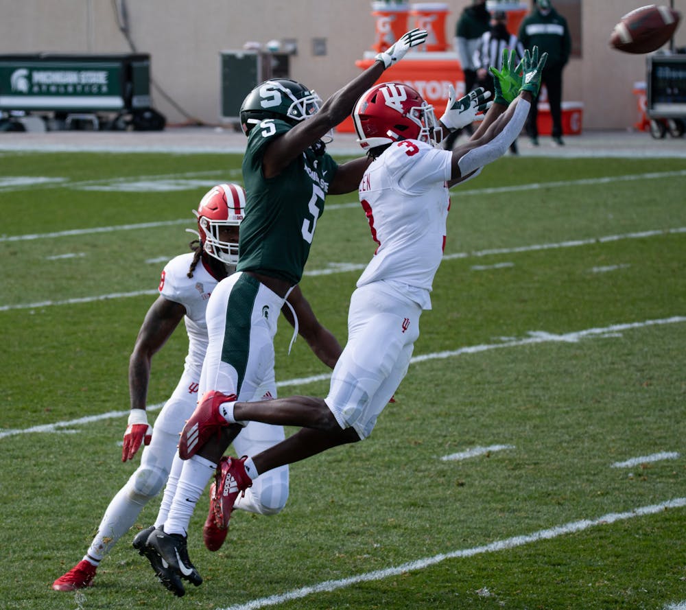 <p>MSU wide receiver, Jayden Reed (5), attempts to catch a pass from Rocky Lombardi (not shown) during a football game against Indiana University at Spartan Stadium on Nov. 14, 2020.</p>