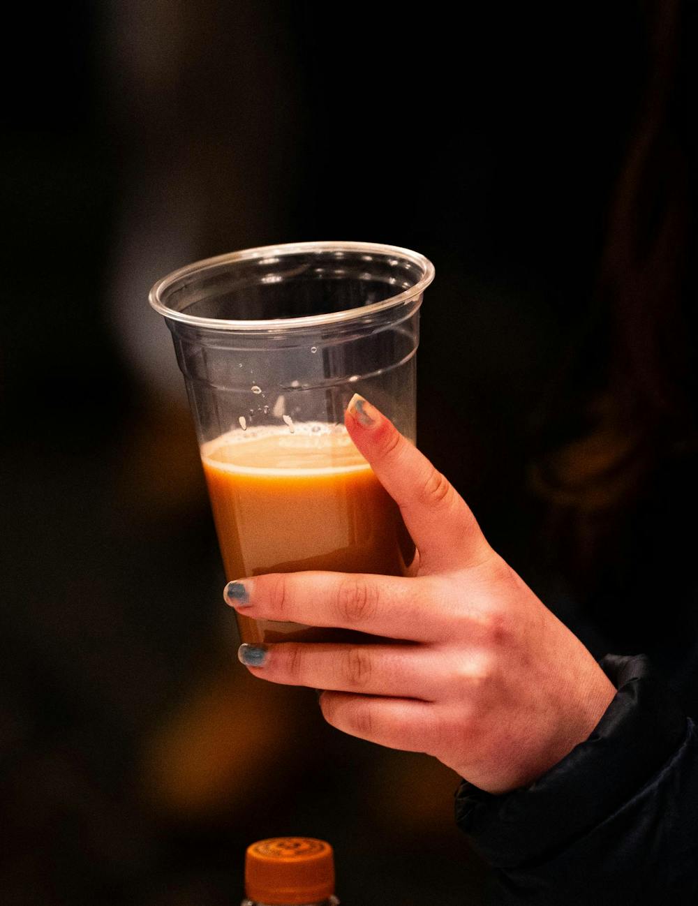 An attendant holding their dirty soda during the UAB and CHAARG clamp event at the MSU Union, in East Lansing on, Jan. 14th 2025