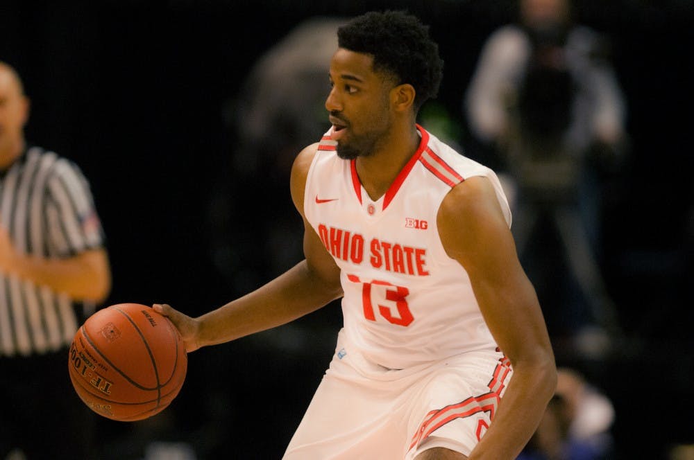 Ohio State guard JaQuan Lyle looks to pass during the first half of the game on March 10, 2016 at Bankers Life Fieldhouse in Indianapolis, Indiana. The Spartans play the Buckeyes Friday March 11, 2016 at 6:30 p.m. 