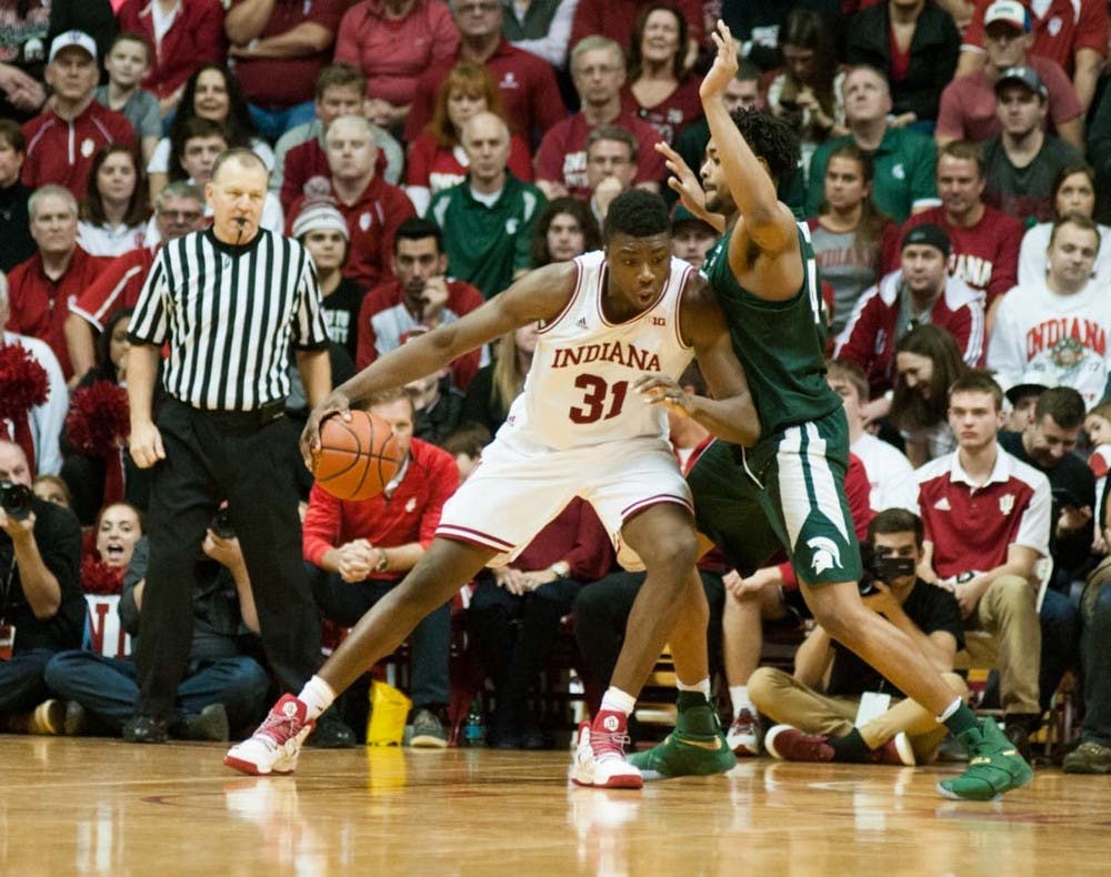 Freshman forward Nick Ward (44) utilizes his entire body to block sophomore center Thomas Bryant (31) during the second half of the men?s basketball game against Indiana on Jan. 21, 2017 at Assembly Hall. The Spartans were defeated by the Hoosiers, 75-82.