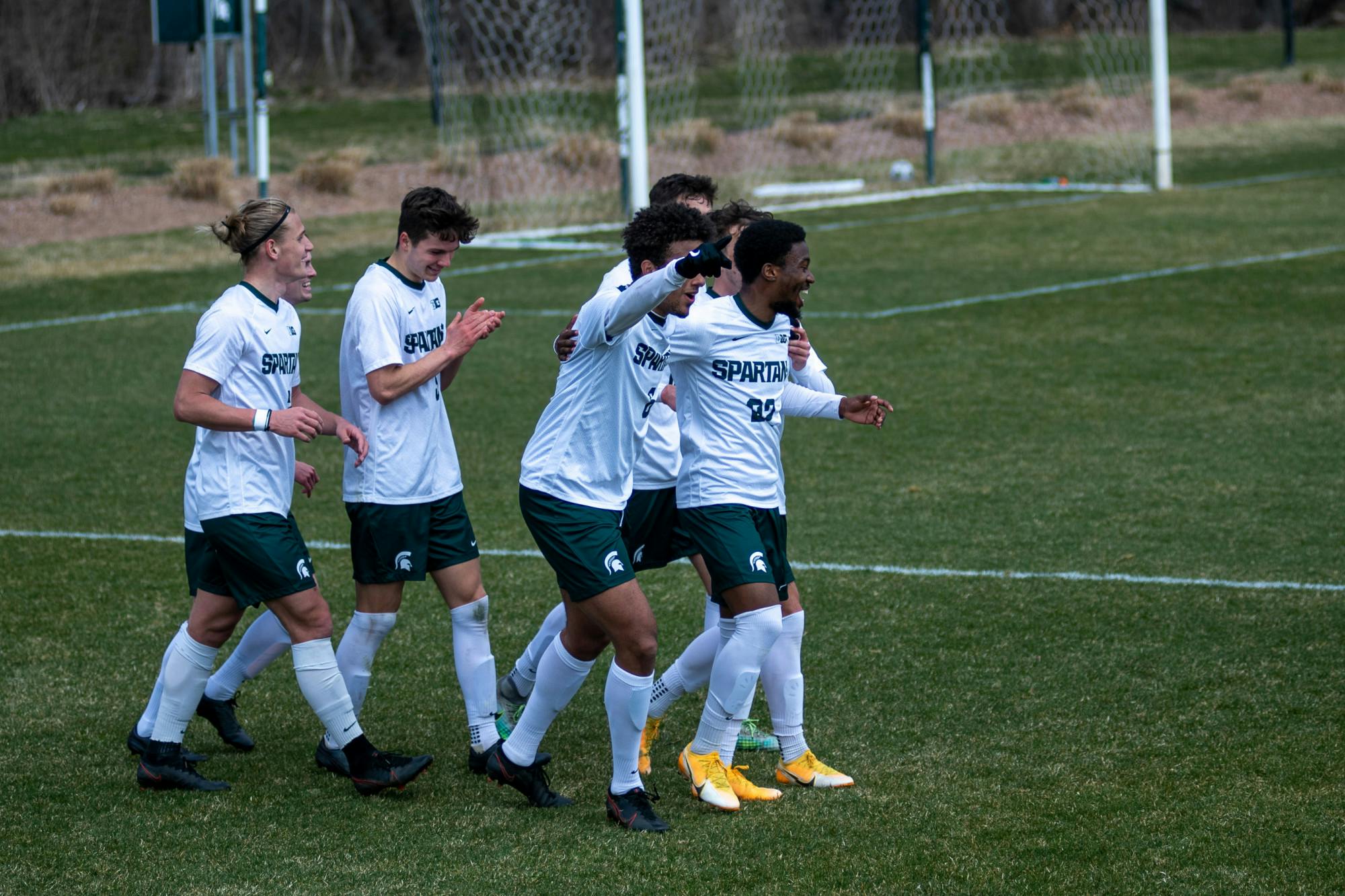 <p>Members of MSU men&#x27;s soccer celebrate after scoring their 3rd goal of the game against Wisconsin on March 31, 2021, at DeMartin Stadium in East Lansing, Michigan. </p>