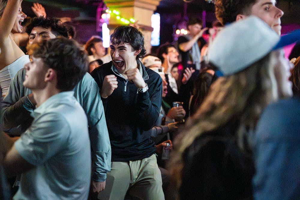 <p>Fans cheer as Michigan State scores against UConn during the NCAA men’s basketball tournament regional semifinal while watching at Harper’s Brew Pub in East Lansing, Michigan on Friday, March 27, 2026.</p>
