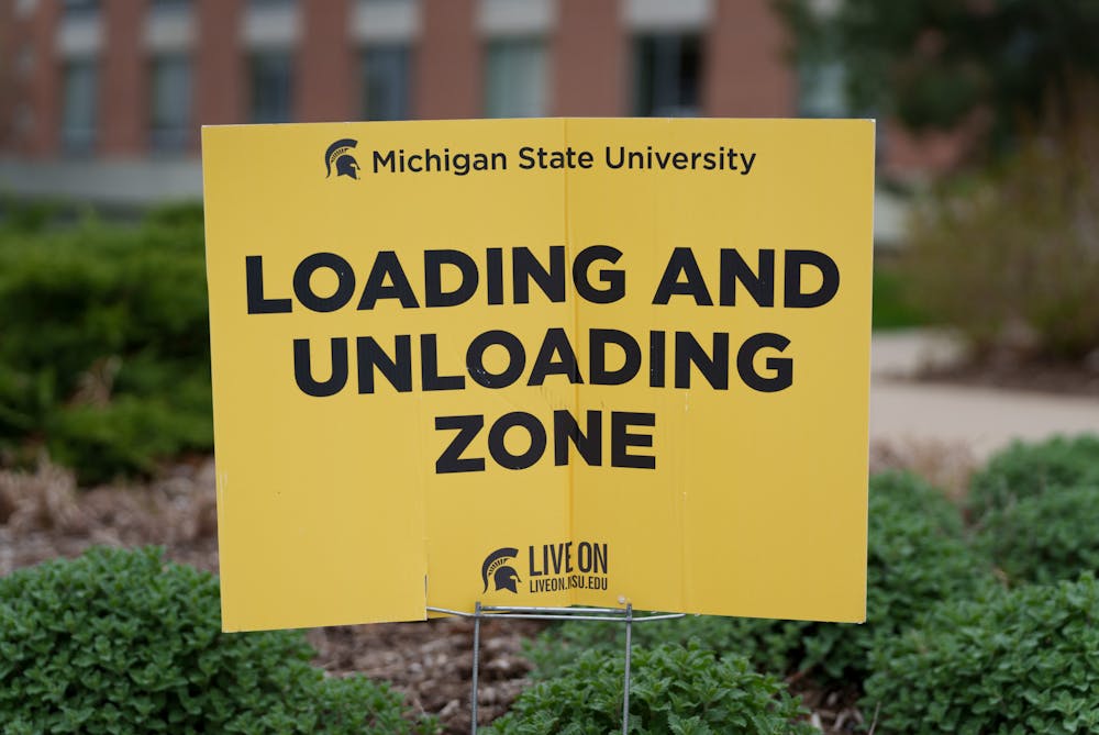 Loading and unloading zone sign outside of west Holmes Hall as students begin to go back home, on May 4, 2022.