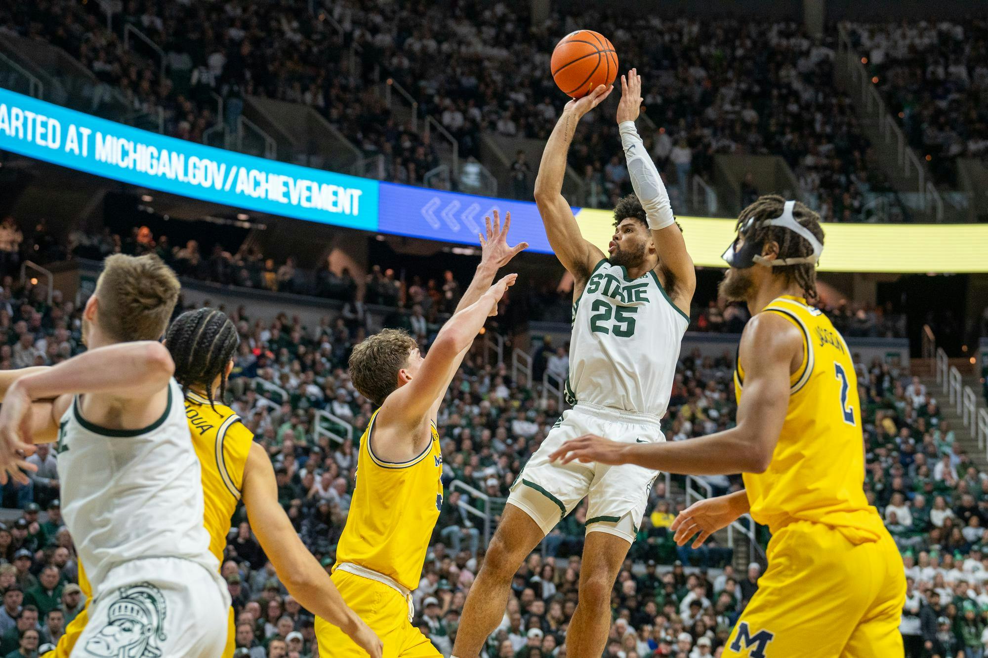 Graduate Student forward Malik Hall (25) taking a fadeaway shot attempt during a game against University of Michigan at the Breslin Student Event Center on Jan. 30, 2024. 
