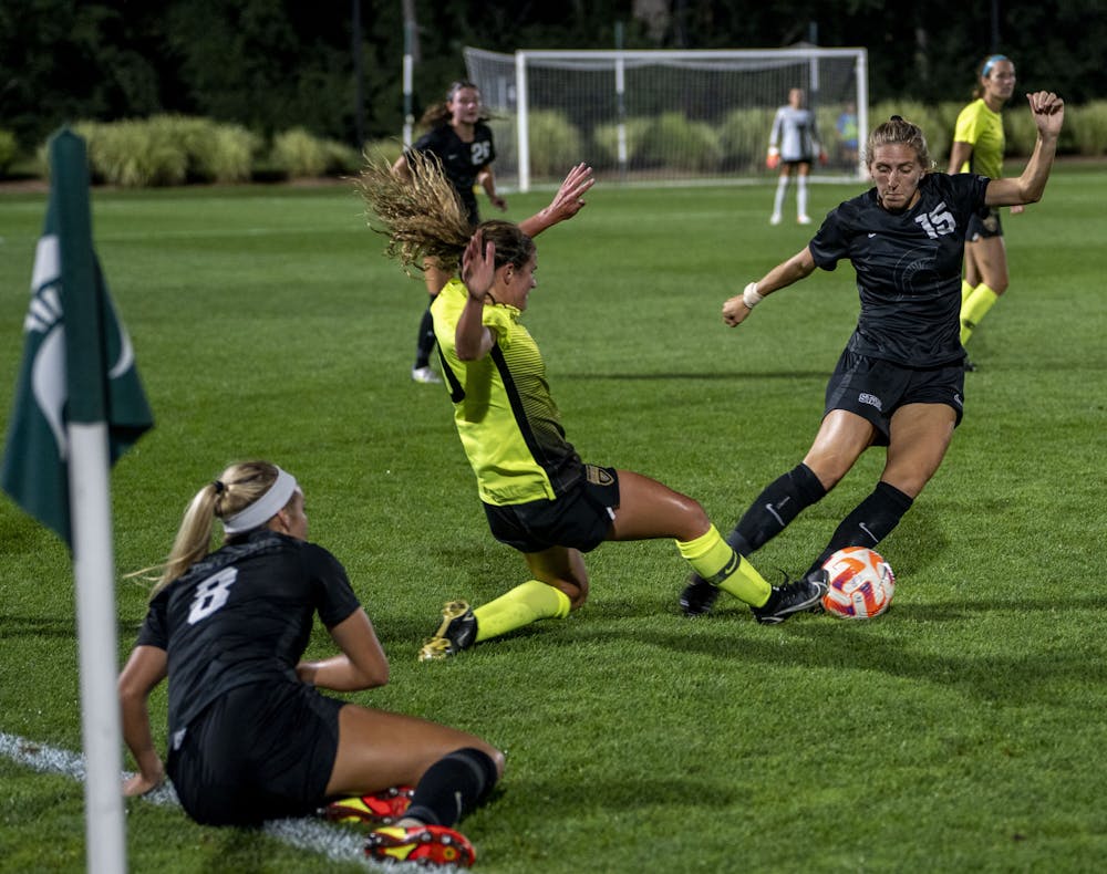 <p>Graduate level midfielder Celia Gaynor (15) and Oakland’s Macey Wierenga (10) face off during a MSU and Oakland women’s soccer game at DeMartin Field in East Lansing on Sept. 8, 2022. The Spartans and Grizzlies tied, 0-0.</p>