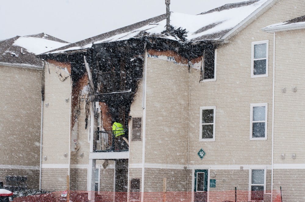 Fire inspector Don Carter inspects the scene on March 1, 2016 at Chandler's Crossings. A fire broke out Feb. 29, 2016 in which 18 rooms were effected and residents had to be relocated.