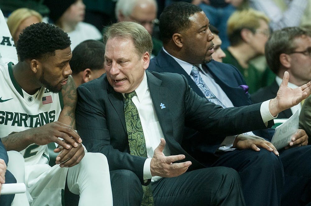 <p>Head coach Tom Izzo talks to senior guard/forward Branden Dawson on the bench Feb. 7, 2015, during the game against Illinois at Breslin Center. The Spartans were defeated by the Fighting Illini, 59-54. Erin Hampton/The State News</p>