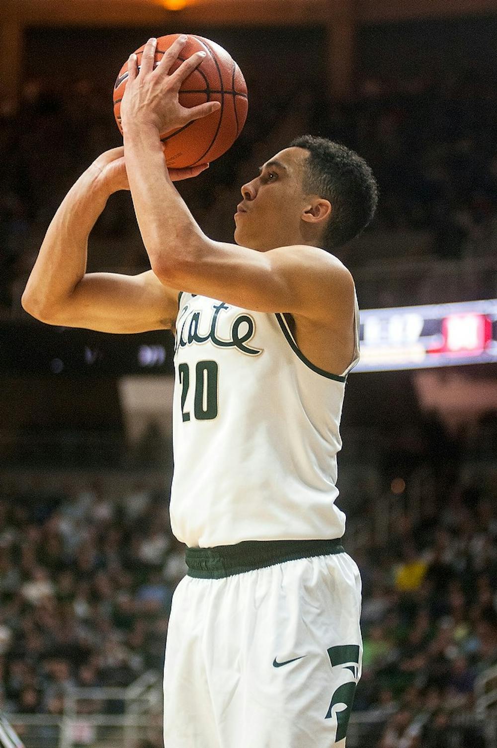 <p>Senior guard Travis Trice takes a jump shot during the game against Maryland on Dec. 30, 2014, at Breslin Center. The Spartans were defeated by the Terrapins, 68-66 in double overtime. Danyelle Morrow/The State News</p>