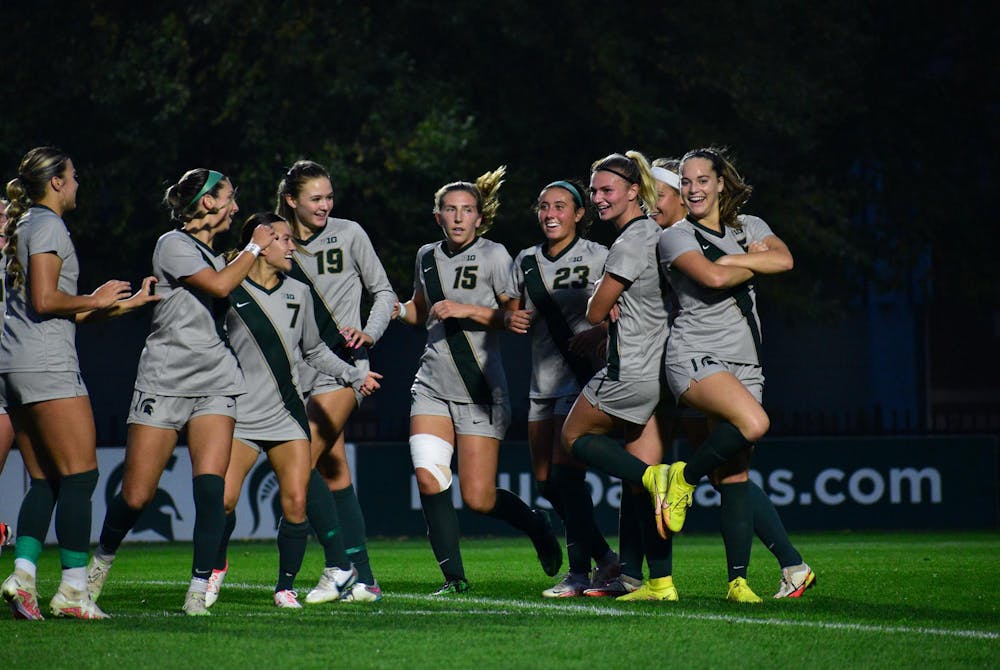 Michigan State women's soccer team celebrates junior forward Jordyn Wickes, #12, for scoring a goal, as well as senior midfielder Regan Dalton, #5, for an assist at a game against Maryland at DeMartin Stadium on Sept. 28, 2023. The Spartans won 5-0.