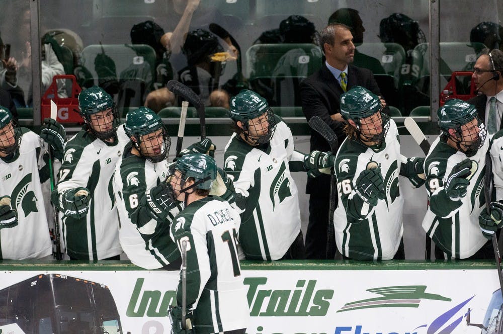 	<p>Senior left wing Dean Chelios bumps fists with teammates after scoring a goal during the game against Western Ontario on Oct. 9, 2013, at Munn Ice Arena. The Spartans defeated the Mustangs, 4-1, in the first exhibition game of the season. Danyelle Morrow/The State News</p>