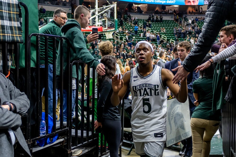 Senior guard Cassius Winston high-fives fans after a game against Maryland. The Spartans fell to the Terrapins, 60-67, at the Breslin Student Events Center on February 15, 2020. 