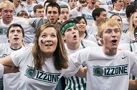 <p>Members of the Izzone sway side-to-side as the Spartan basketball team is introduced  Tuesday, Nov. 20, 2012, at Breslin Center. The MSU basketball team defeated Boise State, 74-70, to improve the Spartan's record to 3-1. Adam Toolin/The State News</p>