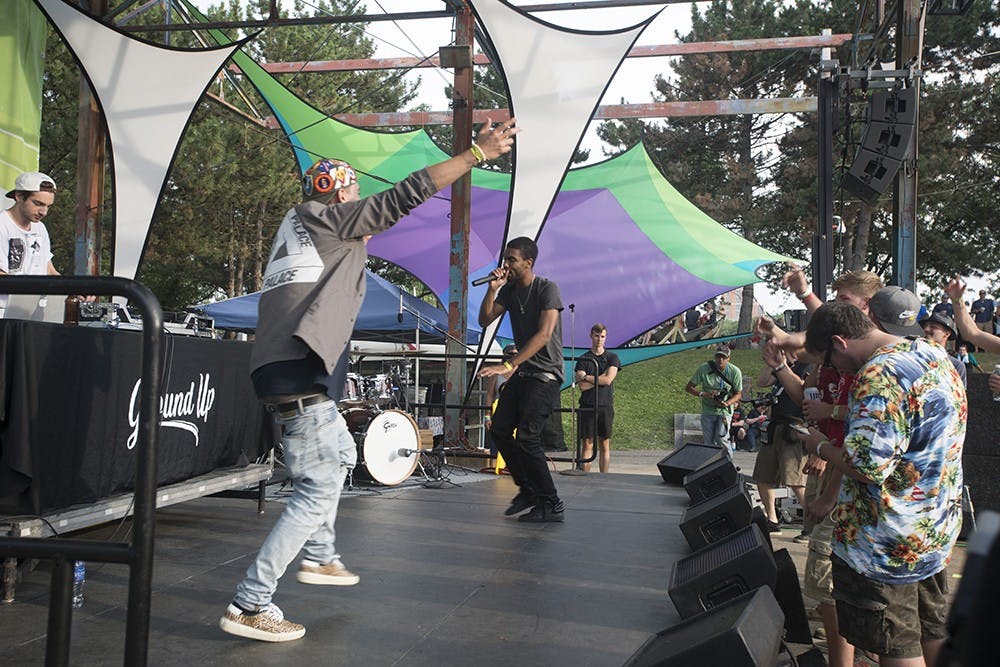 Ground Up, a hip hop group all the way from Philadelphia, PA, performs on the Sparrow Stage at the Common Ground Music Festival in Lansing July 11, 2015. The crowd interacts sings along to the bands original songs and pulse with the beat. Catherine Ferland/ The State News