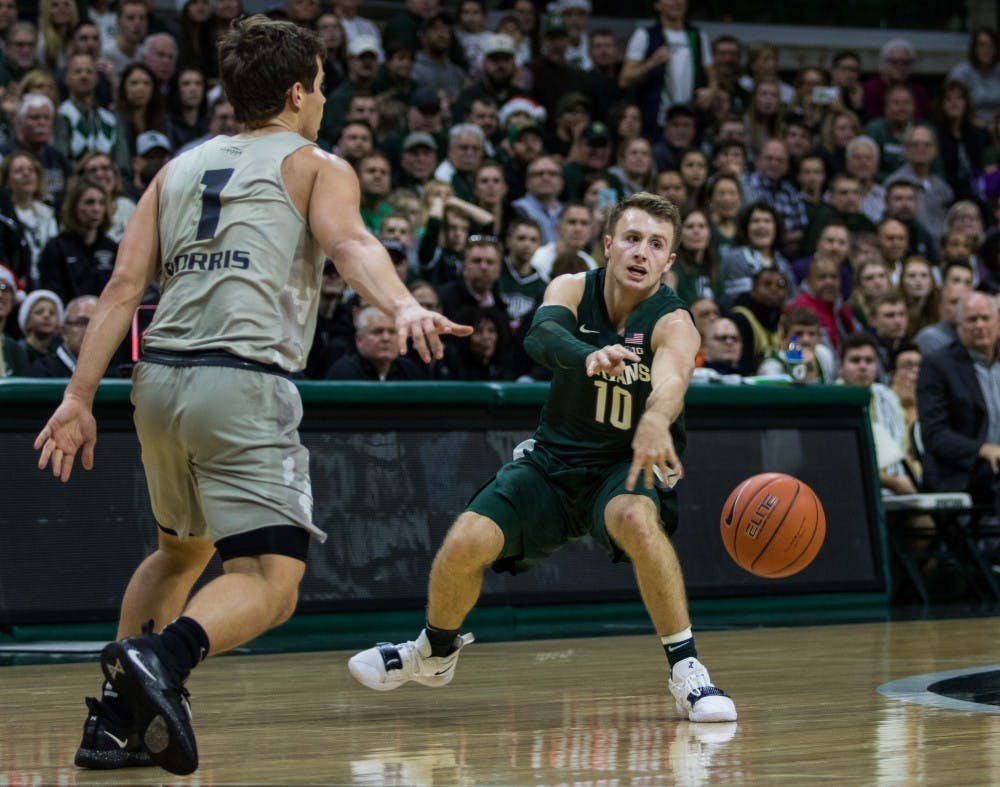 Redshirt freshman guard Jack Hoiberg (10) passes the ball during the game against Oakland University at Breslin Center on Dec. 21, 2018. The Spartans defeated the Grizzlies, 99-69.