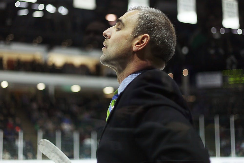 	<p>Head coach Tom Anastos looks down the ice during overtime against Ohio State on Feb. 7, 2014, at Munn Ice Arena. The Spartans tied with the Buckeyes, 2-2, and lost the shootout. Danyelle Morrow/The State News</p>