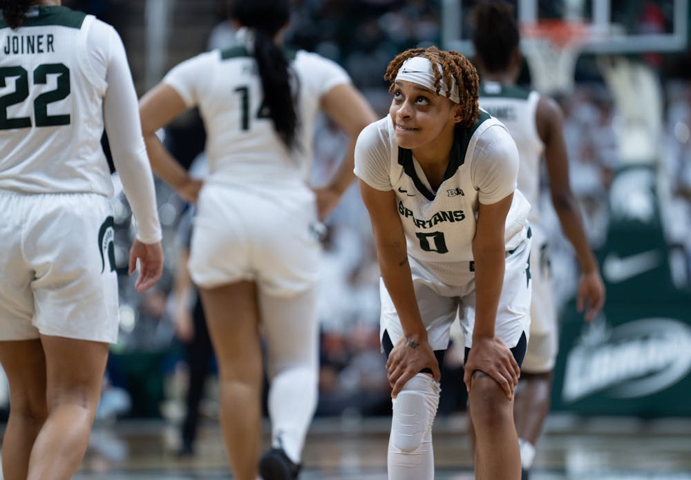 <p>DeeDee Hagemann rests near the end of a 10-point loss to the University of Michigan at the Breslin Center on Sunday, Feb. 5, 2023. Hagemann played the entire 40-minute rivarly game.</p>