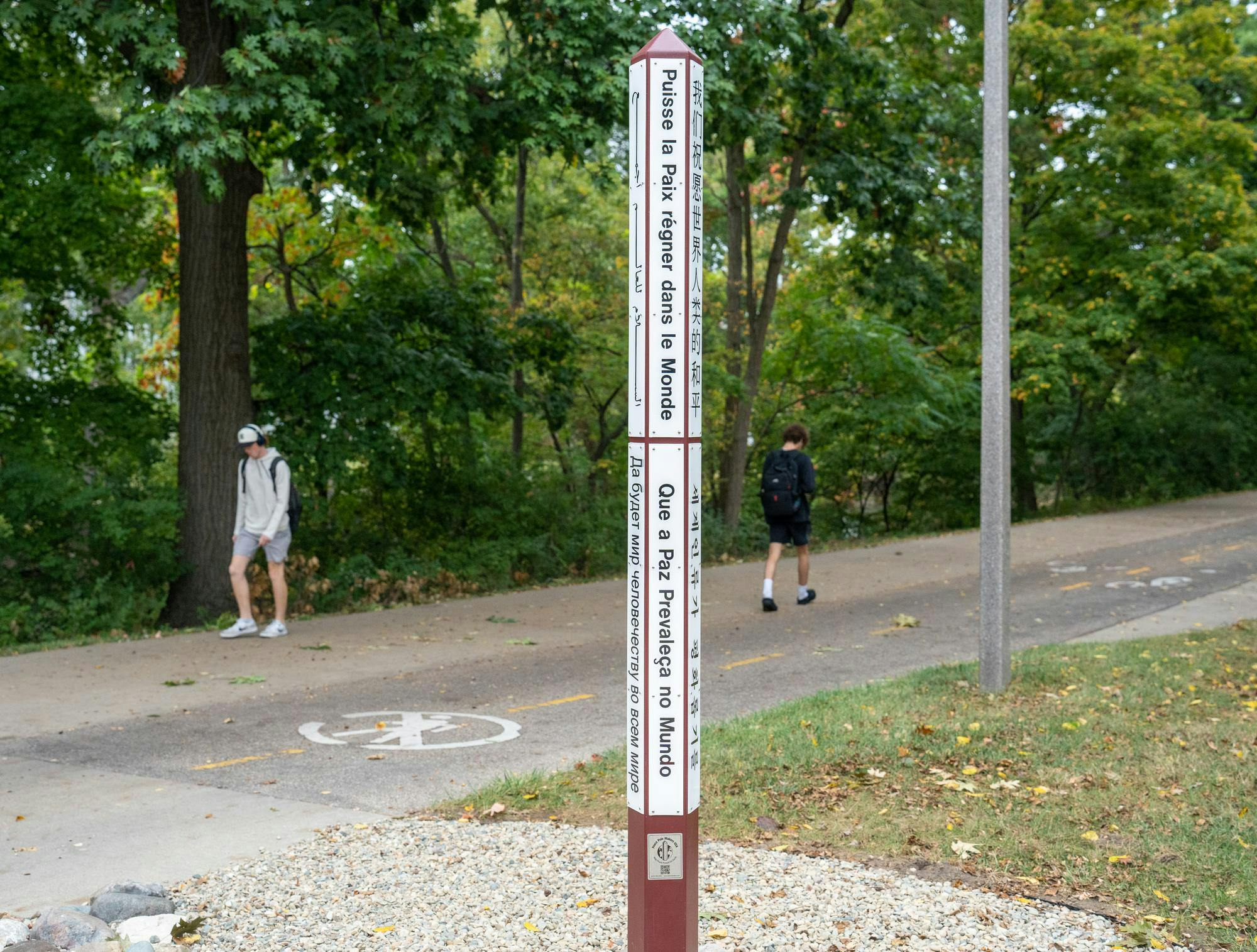 <p>The Greater Lansing UN Association planted a peace pole that reads "May Peace Prevail on Earth" behind the International Center on Oct. 1, 2024. </p>