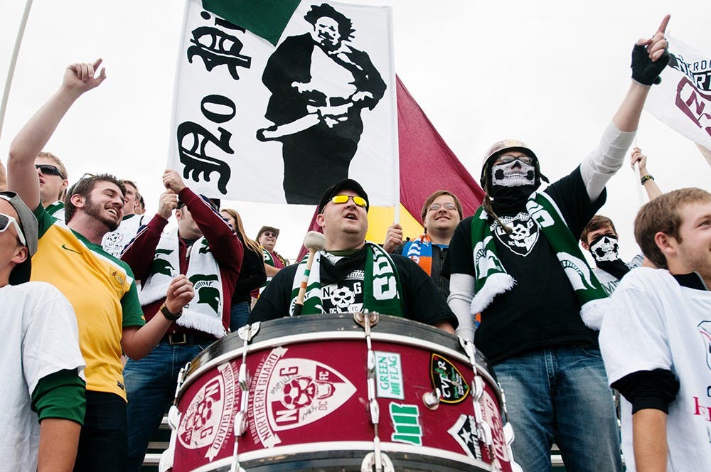 	<p>Members of the Red Cedar Rowdies and surrounding soccer groups cheer during the men&#8217;s soccer game against Northwestern on Sept. 30, 2012. The Red Cedar Rowdies were a fan group founded last year. Julia Nagy/The State News</p>